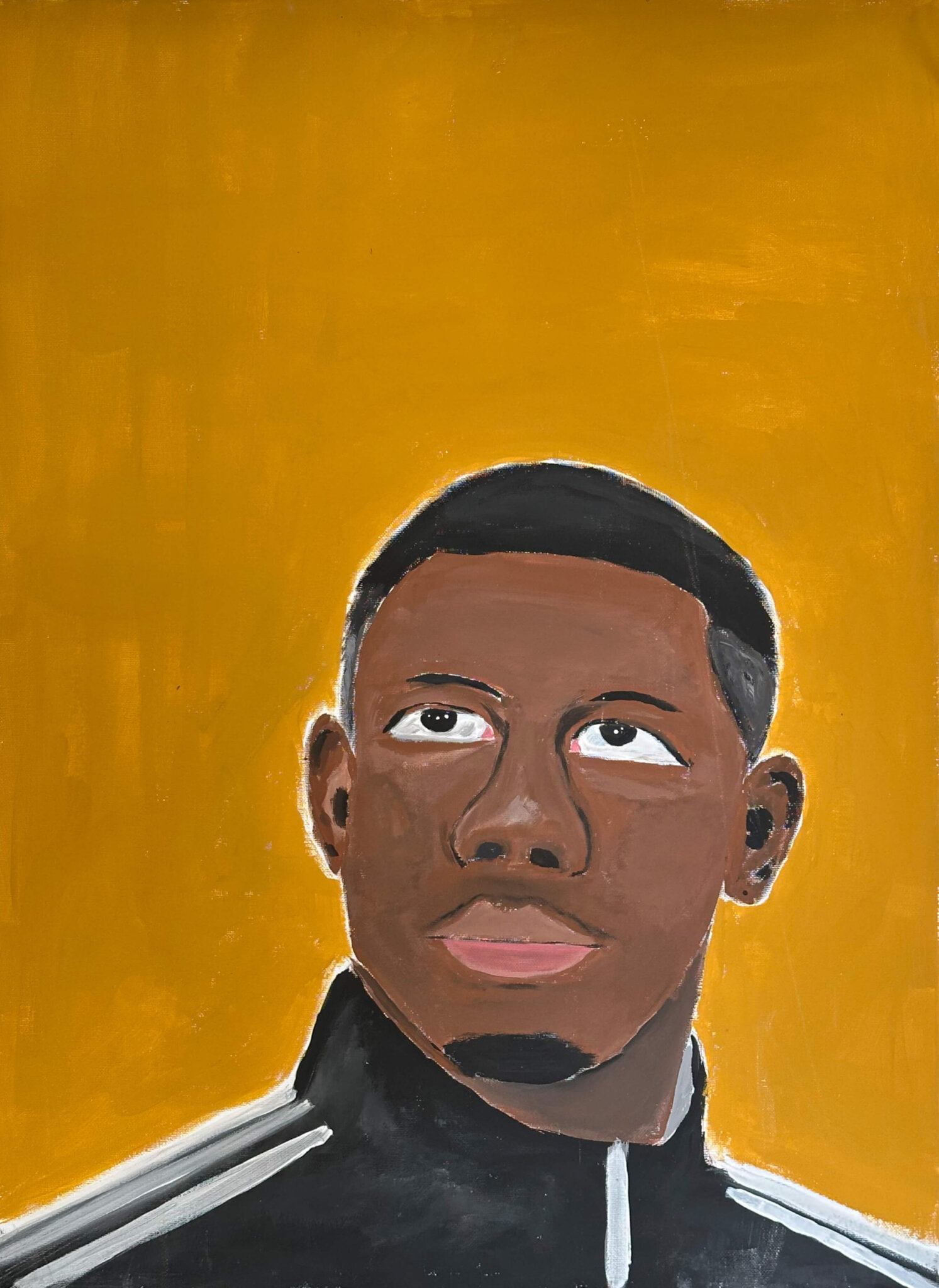 Porträt eines Mannesmit dunkler Hautfarbe und kurzem, dunklem Haar.